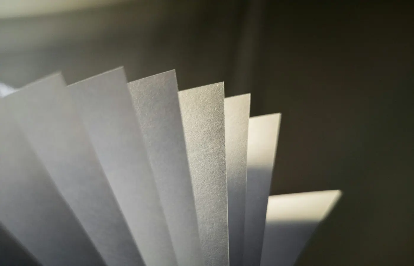 Paper being folded to illustrate grain direction
